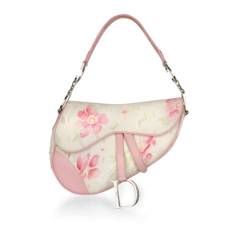 dior saddle bag with dior print and flowers|dior saddle bag on model.